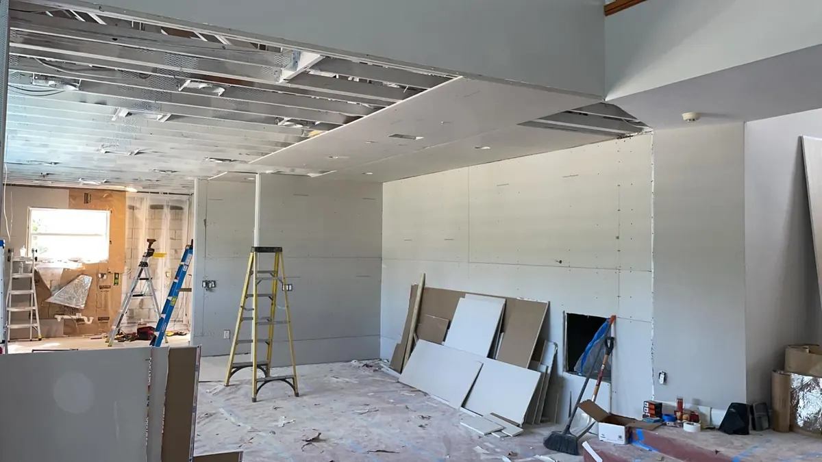 New board hung, ceiling framing underway